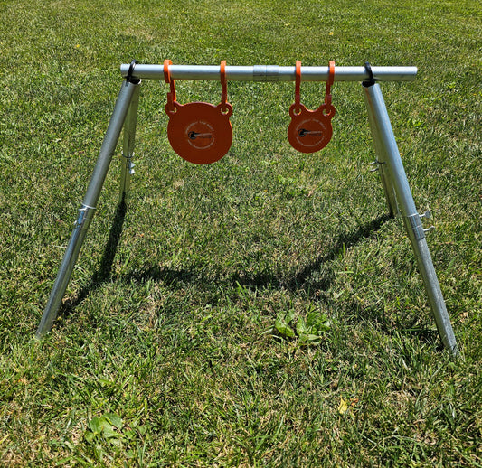 AR500 round gong target showing bullet impact marks